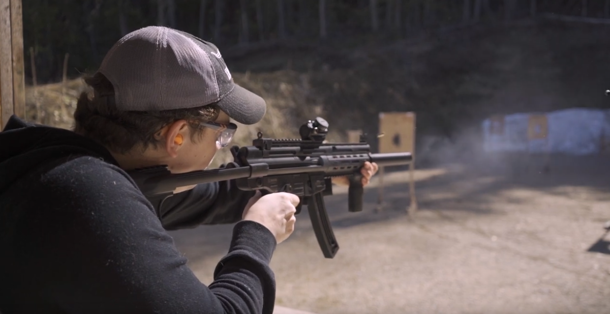 A man firing his weapon.